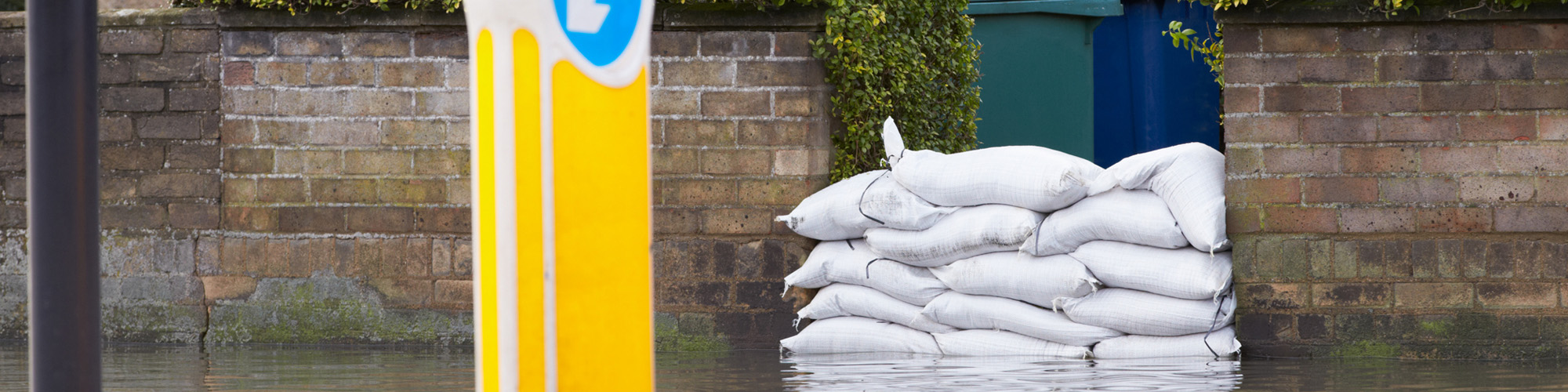 An image of sandbags keeping flood water at bay